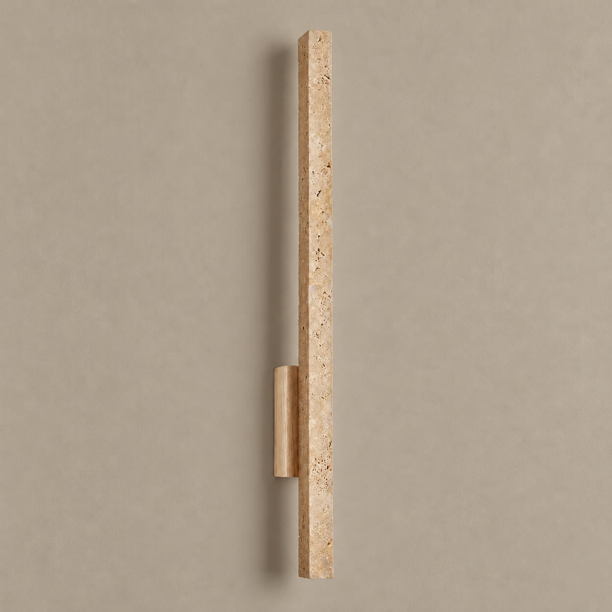 Travertine and wood wall sconce, unlit on a stone-beige wall