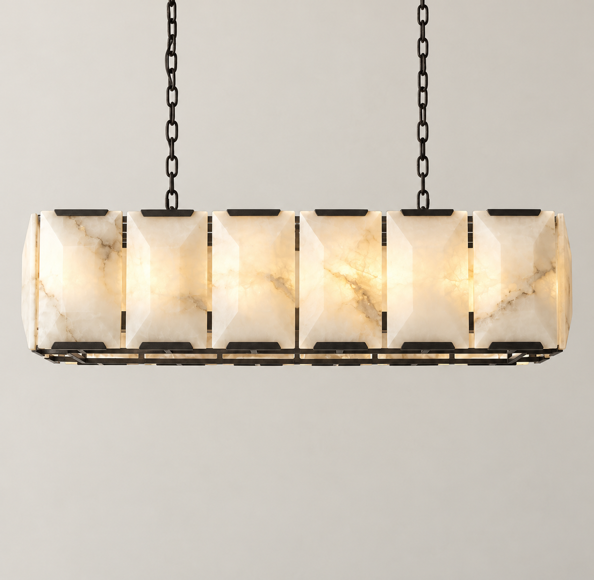100 cm black linear chandelier with six alabaster panels across the front, illuminated.