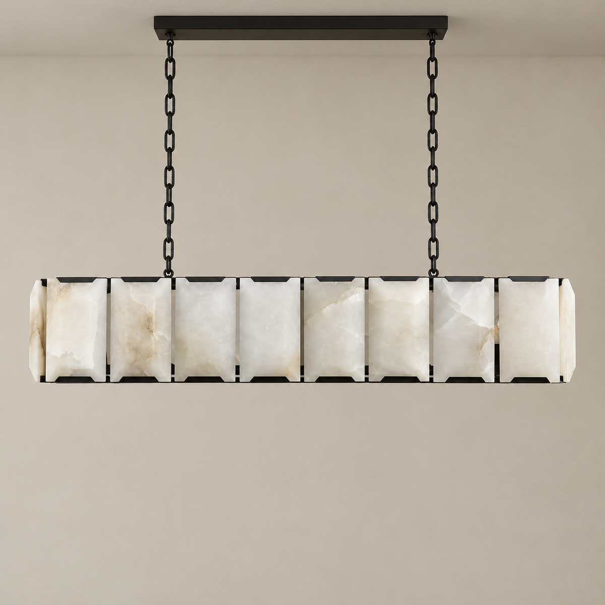 Front view of the black linear alabaster chandelier and its carved panels.