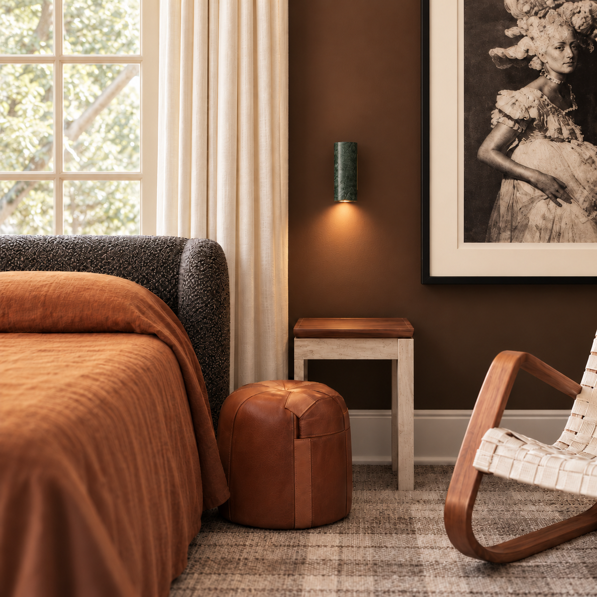 Green marble reading wall light shown straight on beside a bed, with concealed rear mounting plate.