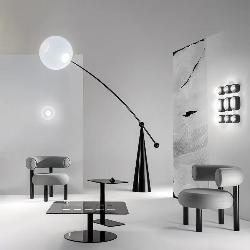 Sculptural floor lamp beside a sofa