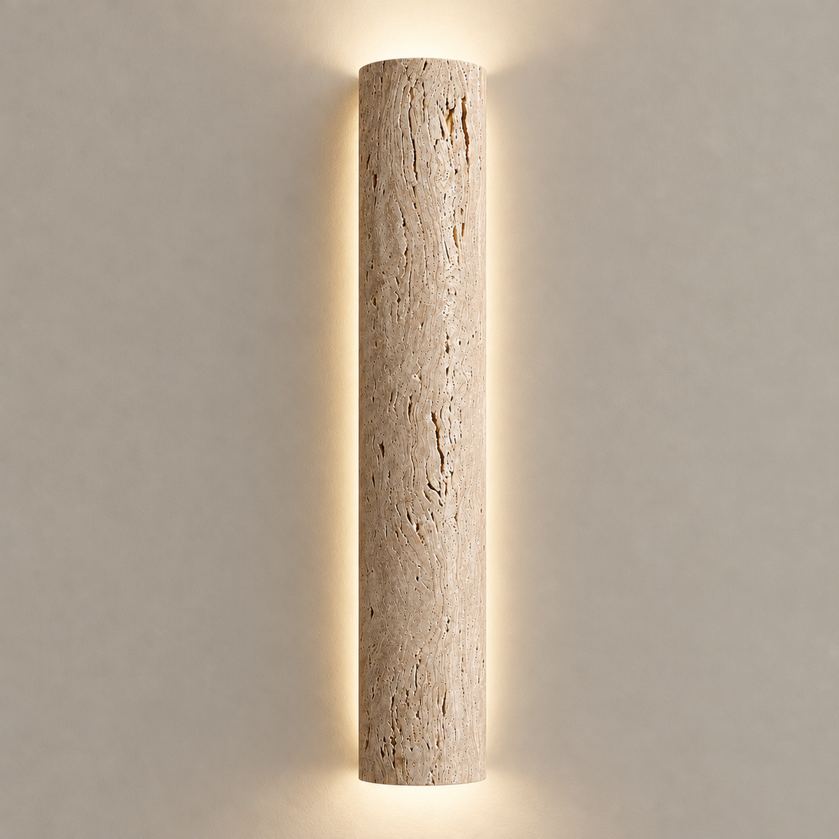 60 cm natural travertine wall sconce illuminated against a stone beige wall.