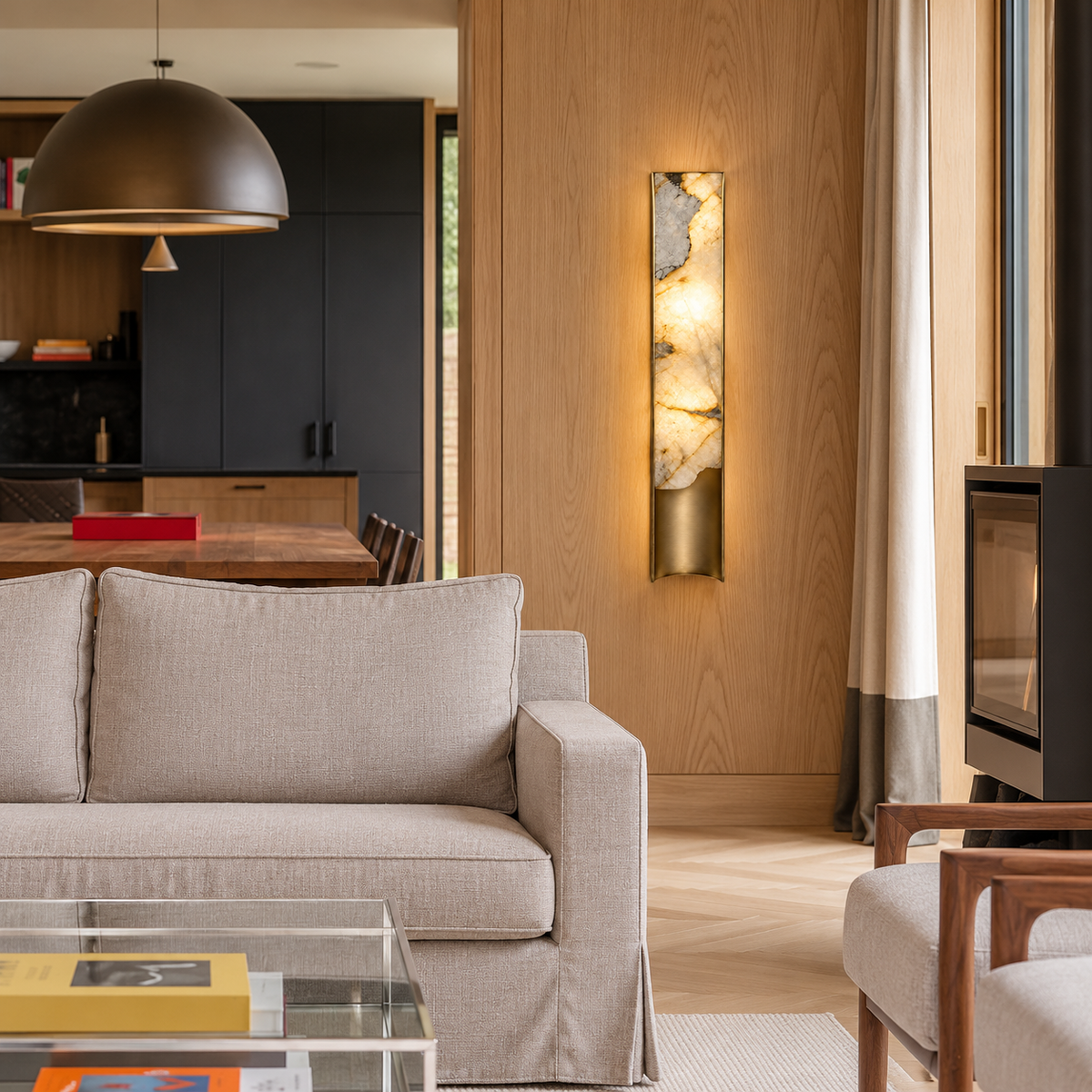 Large onyx wall sconce installed beside a sofa in an oak-panelled living room.