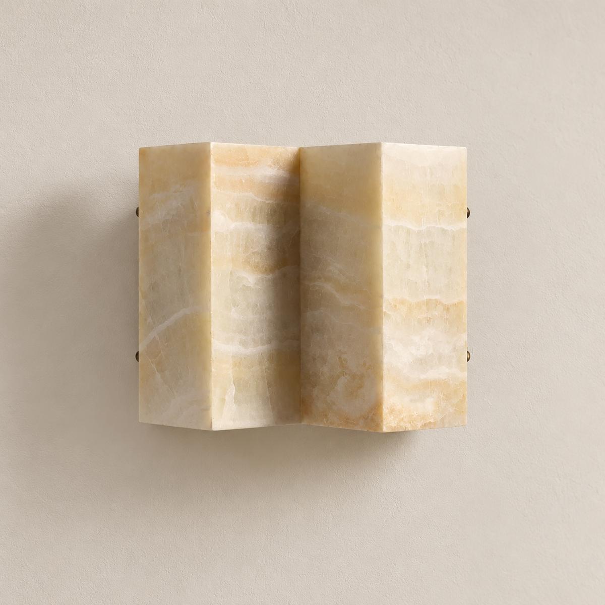 Unlit CLMZUP wide honey onyx wall sconce with two curved stone panels on warm ivory.