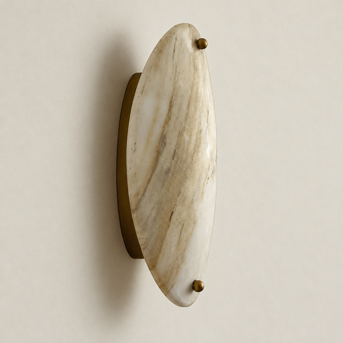 Side view of the oval marble sconce showing its bronze support and wall projection.