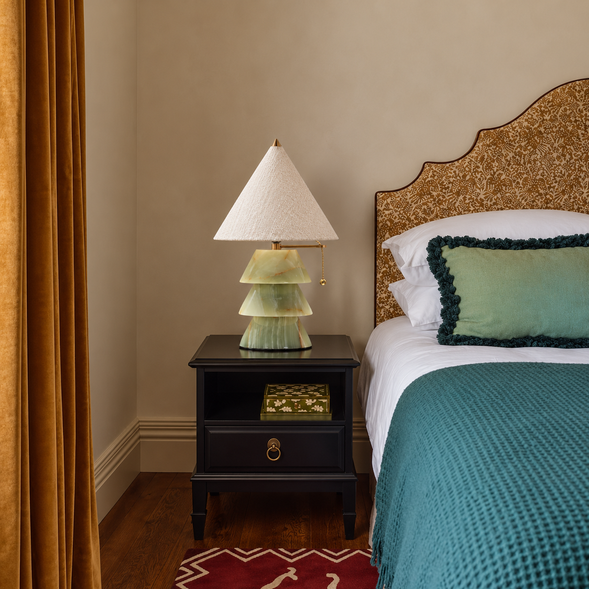 Pagoda green onyx table lamp on a bedside table