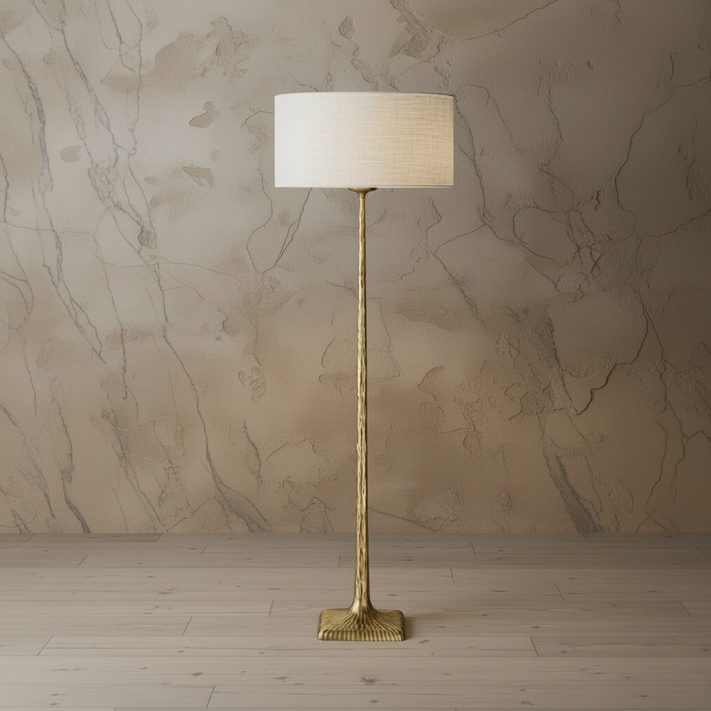 Patinated brass floor lamp with linen shade in a lounge