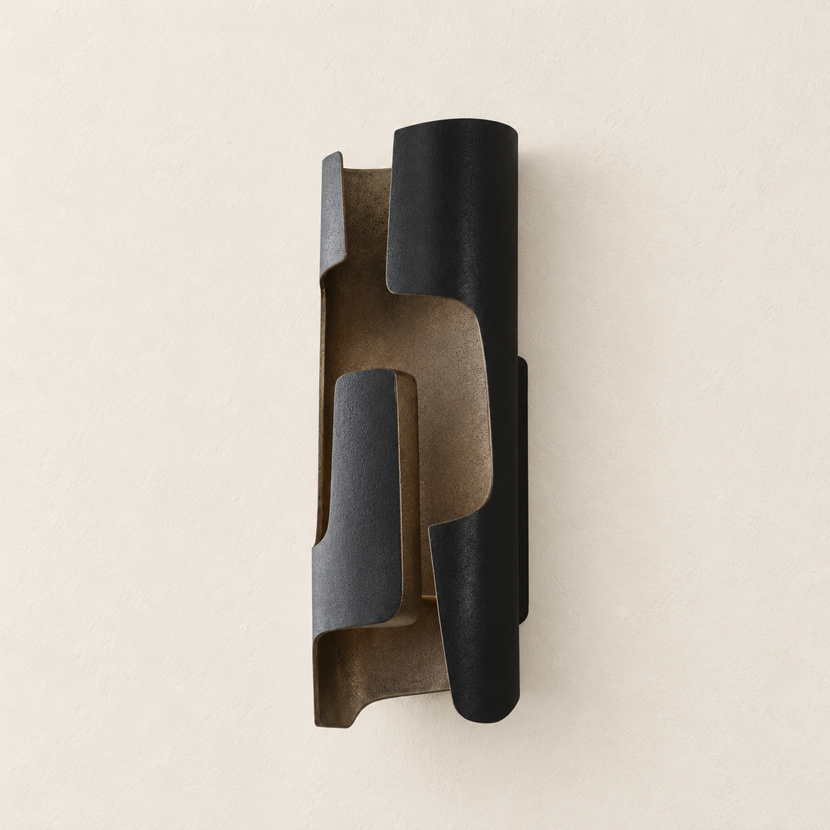 Angled view of slender dark patinated bronze folded sconce, showing its construction.