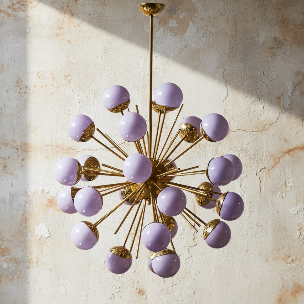 Chandelier with purple spherical lights and gold accents on a white background