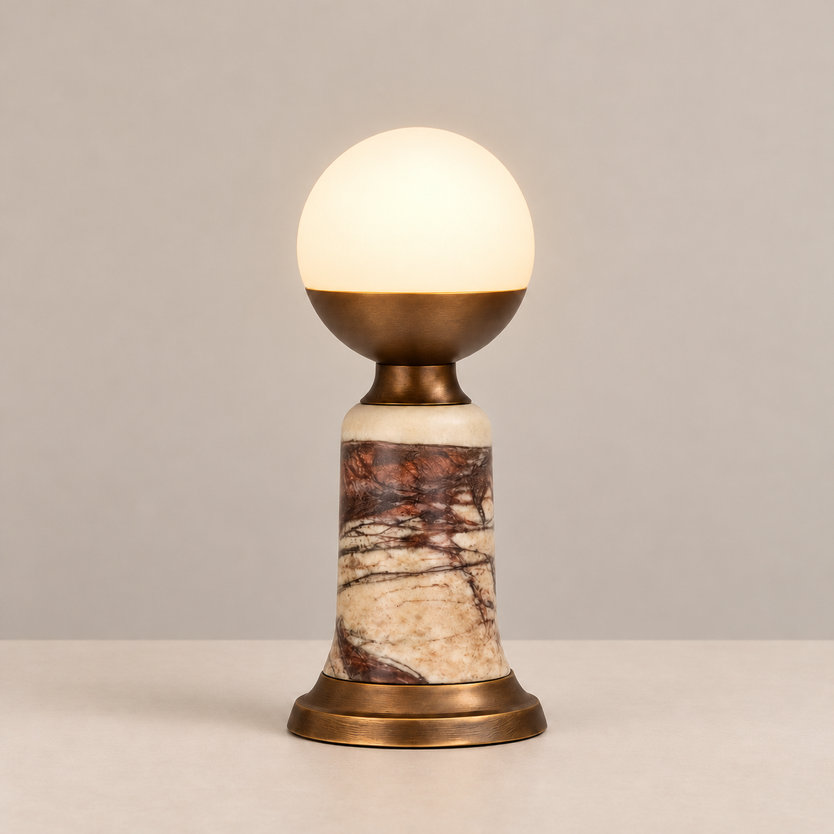 Red Marble Table Lamp, illuminated, on a beige background.