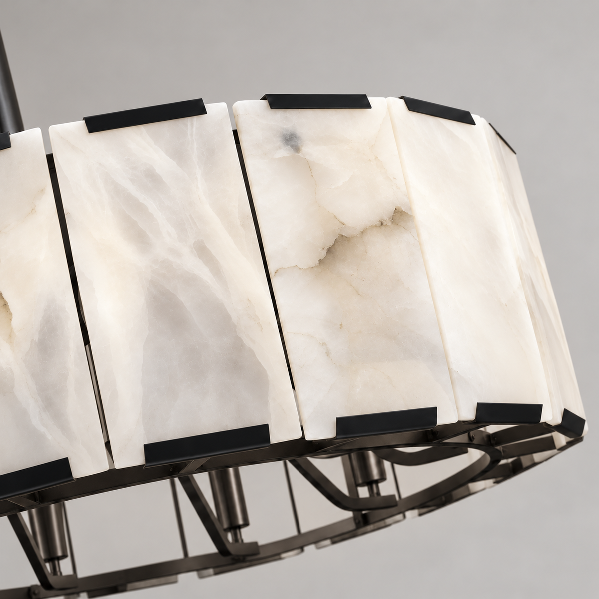 Close view of natural alabaster panels and black retaining clips