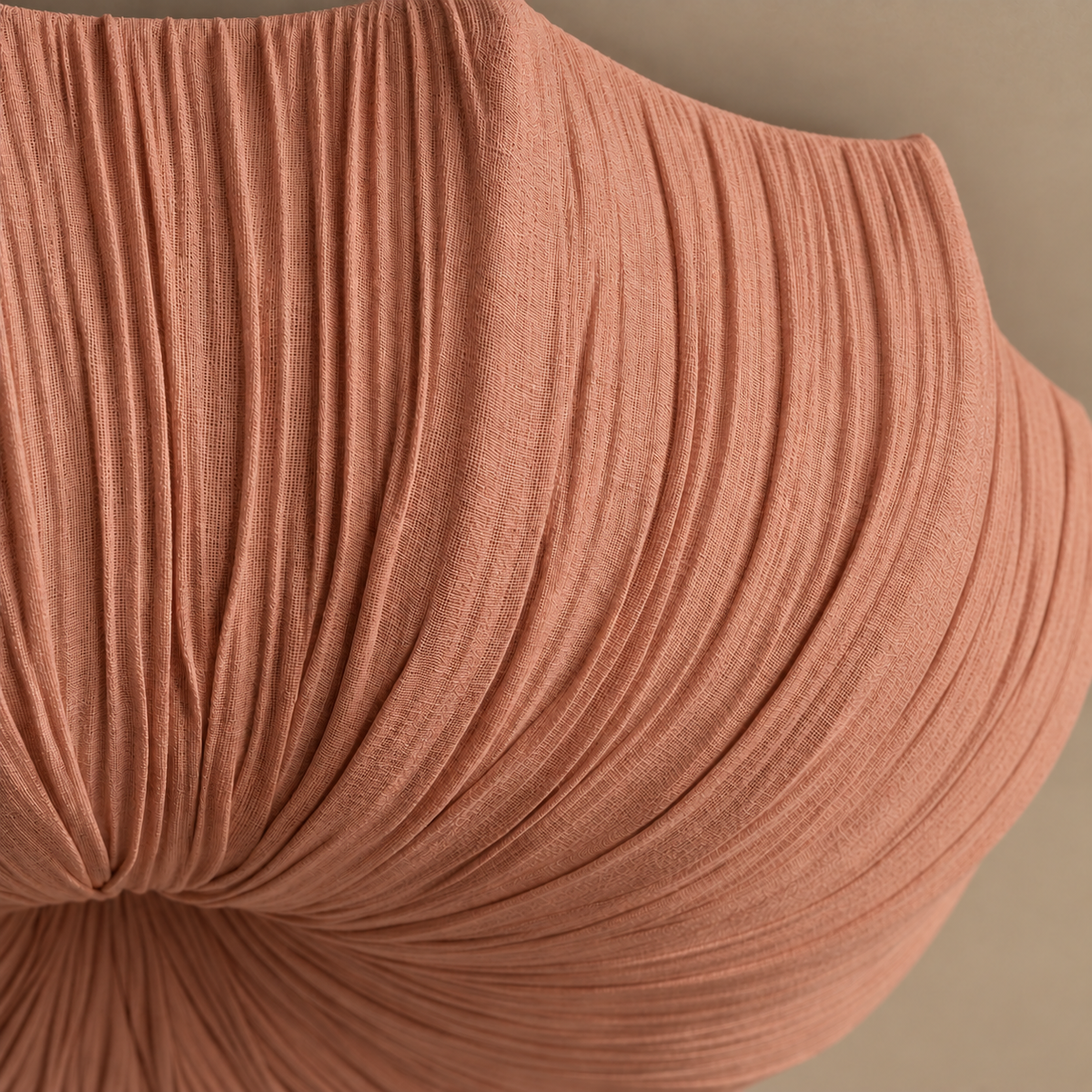 Close-up of the Sabina flush mount’s clay-coloured linen weave and gathered folds.