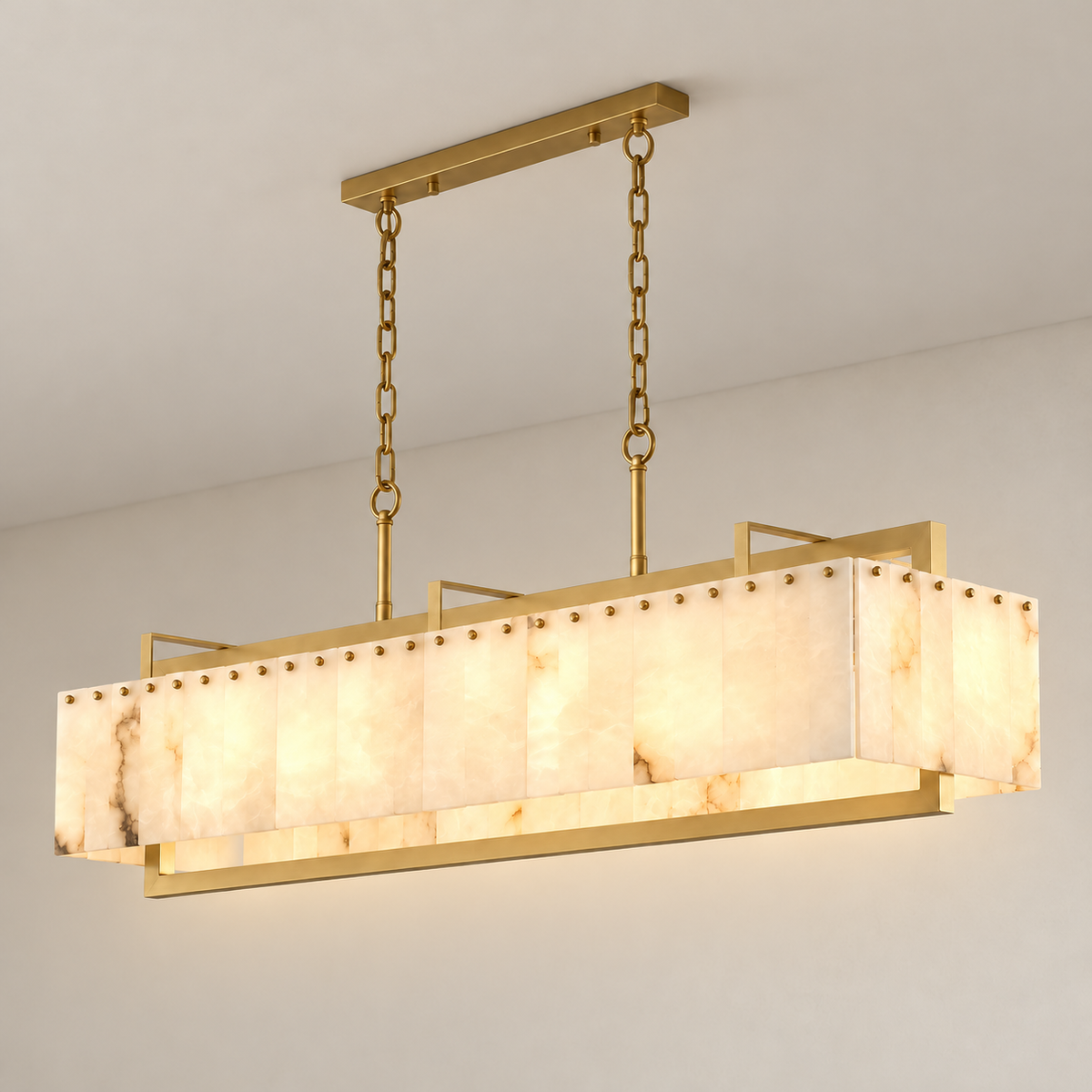 Scrigno chandelier lit through its natural alabaster panels within a brass cage.