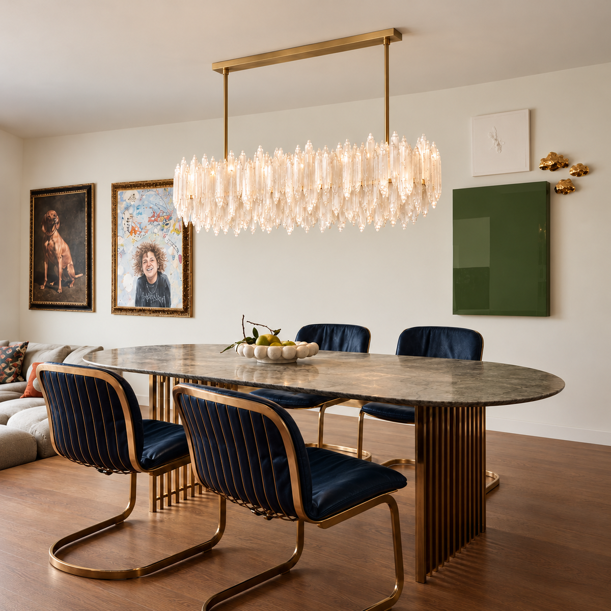 Selenite linear chandelier on two brass rods above an oval marble dining table.