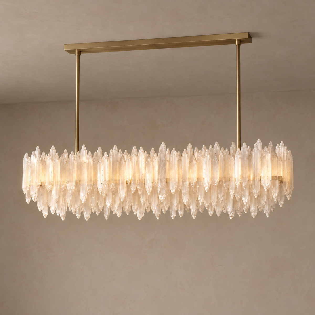 Linear selenite chandelier illuminated with warm light showing through the fibrous white crystals.