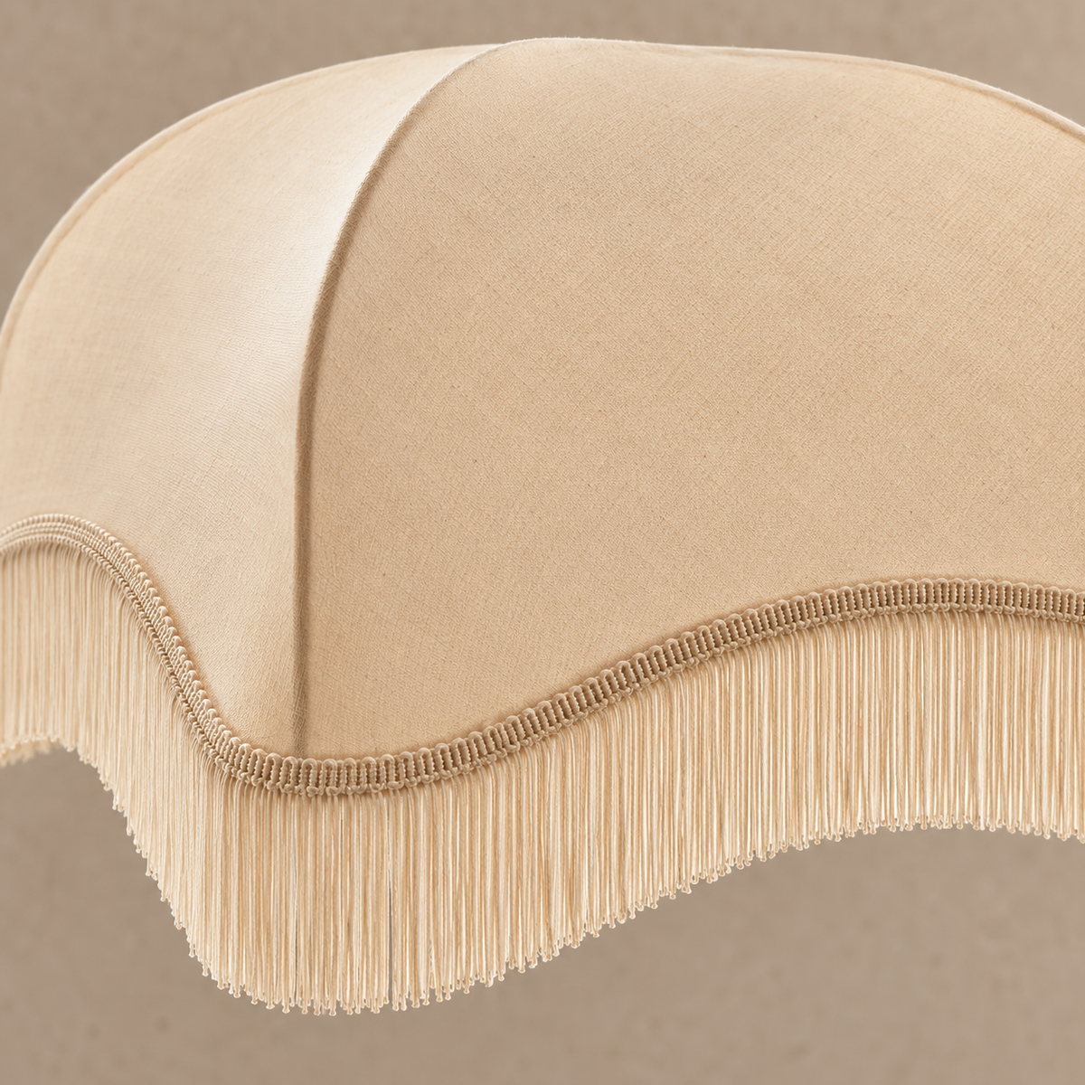 Close detail of the cream scalloped fringe shade.