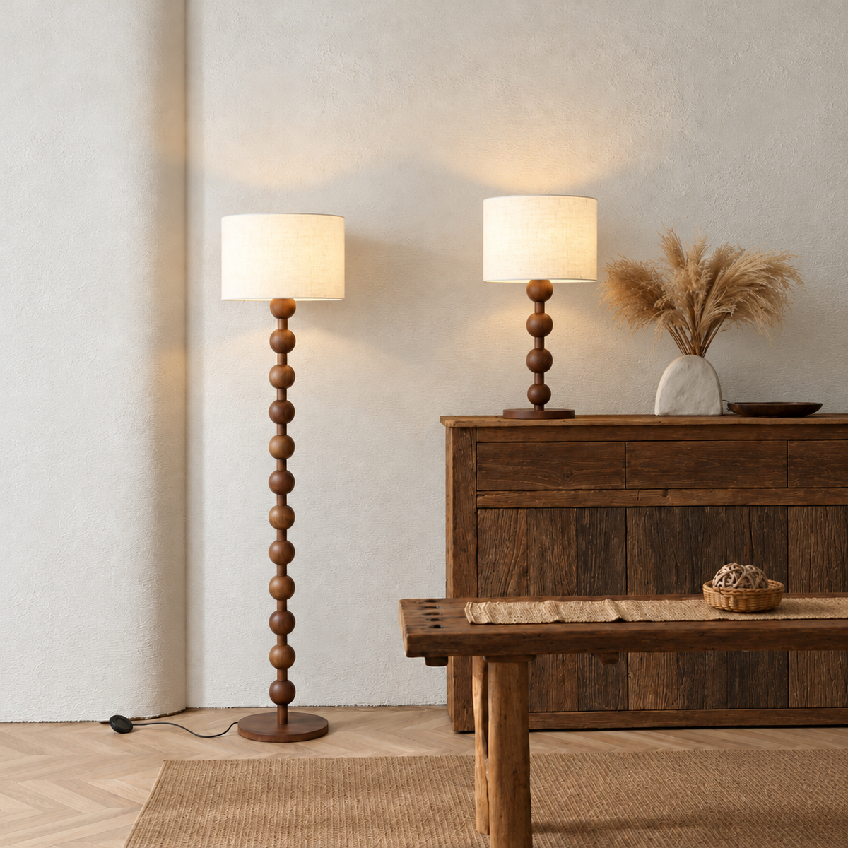 Sirmione walnut floor and table lamps beside a rustic sideboard and wooden bench.