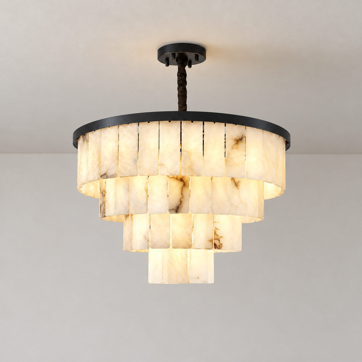 Black tiered alabaster chandelier illuminated, showing natural stone panels and ceiling mounting.