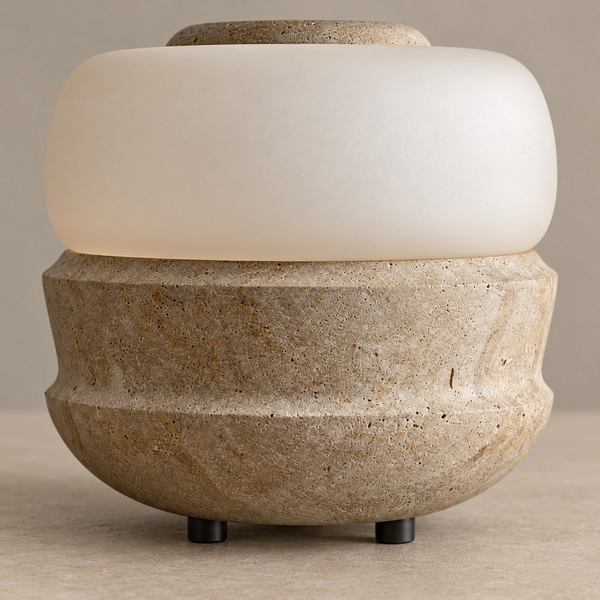 Pitted stone base and rounded frosted glass band