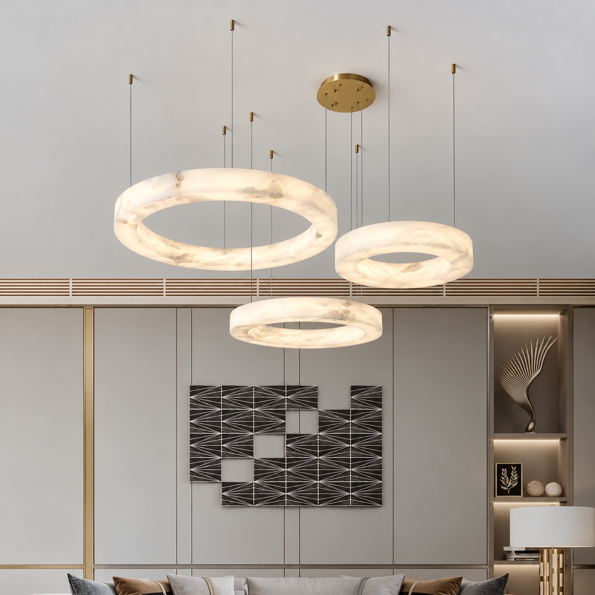 Triplo alabaster ring chandelier installed above a contemporary living-room seating area.
