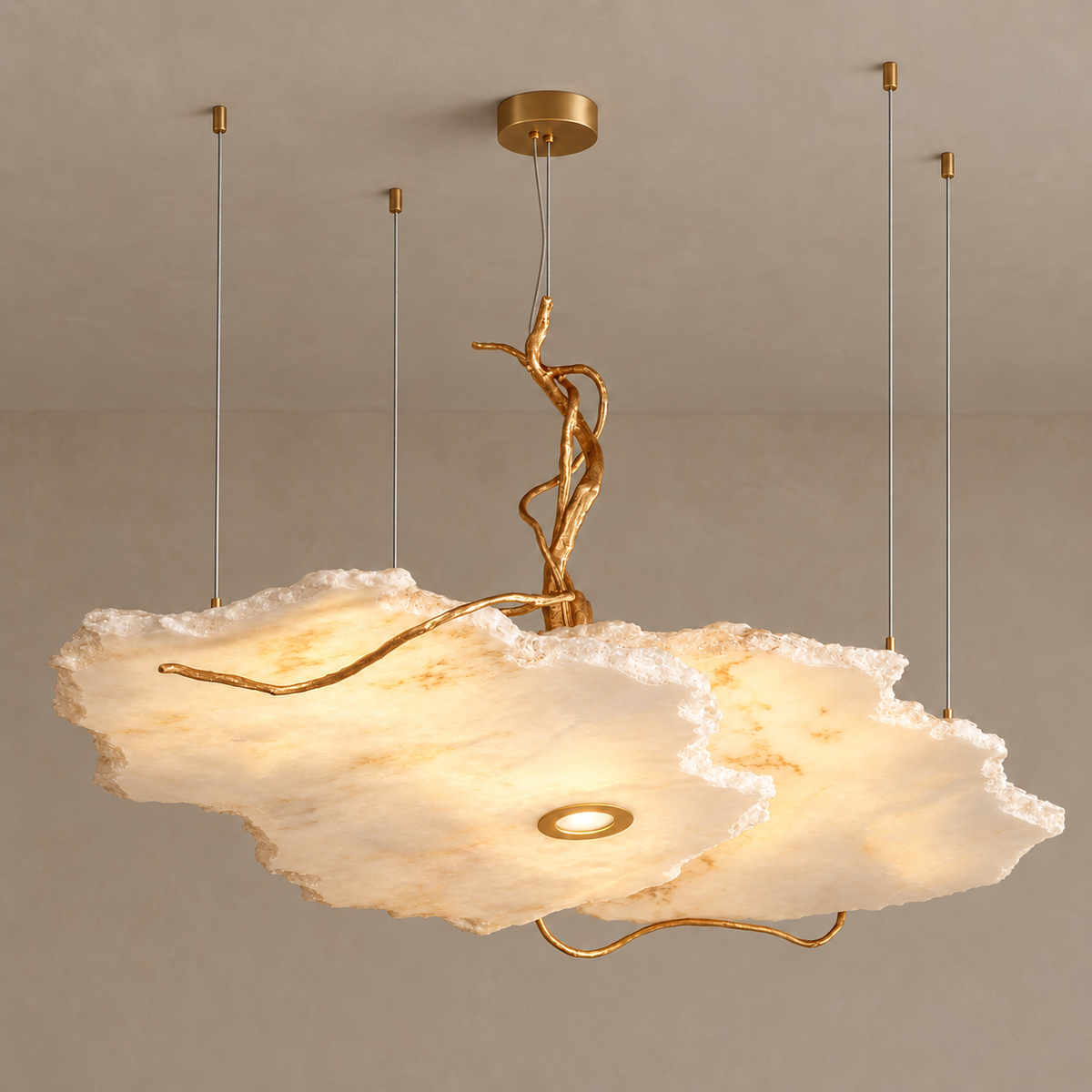 Y alabaster and brass pendant illuminated, showing the stone’s cloudy mineral pattern