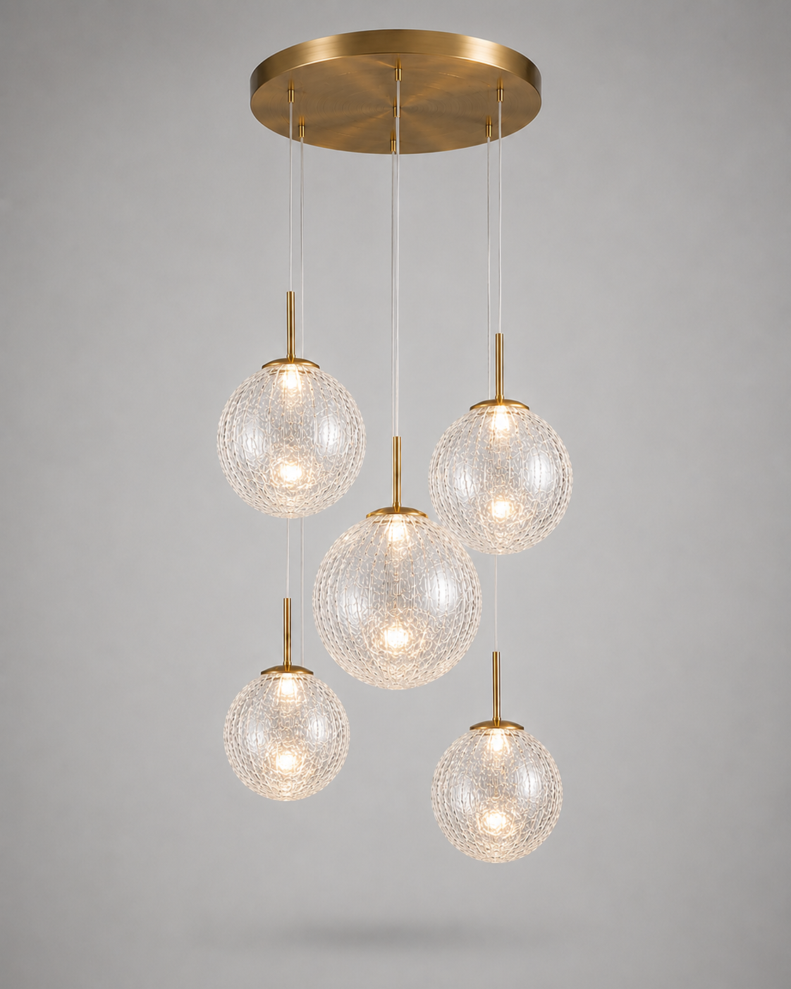 5-light colored glass and brass pendant for a kitchen island, lit — CLND008