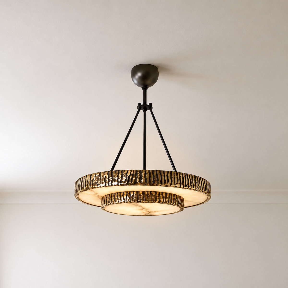 Two-tier round chandelier illuminated through naturally clouded alabaster discs.
