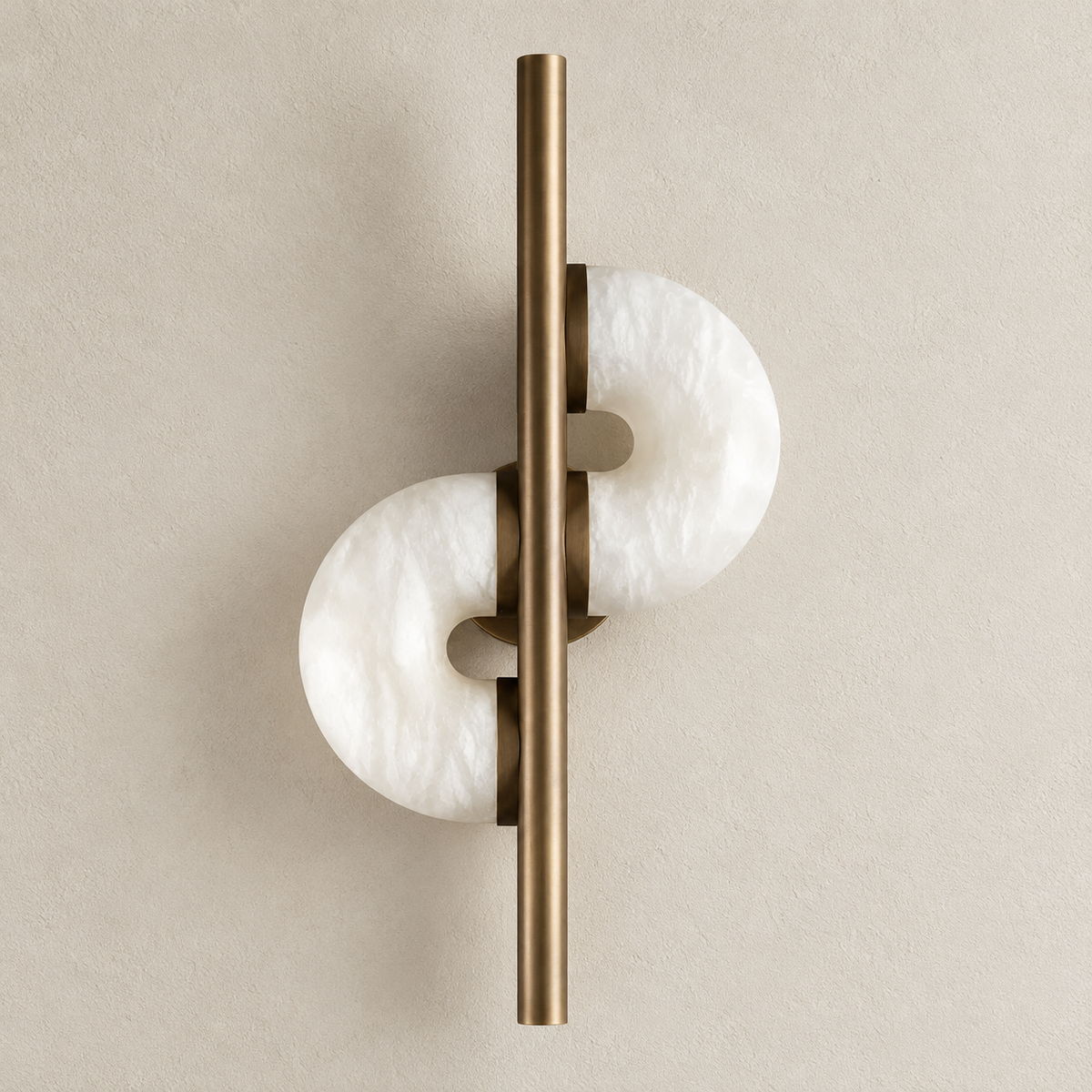 Alabaster C-shaped discs on bronze rods, wall sconce switched off.