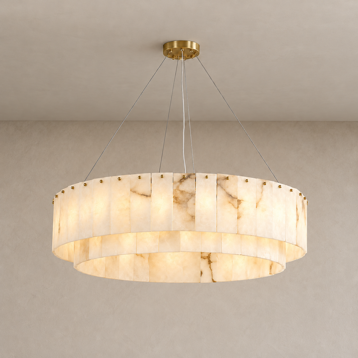Illuminated two-tier alabaster drum chandelier with visible mineral clouds and veins.