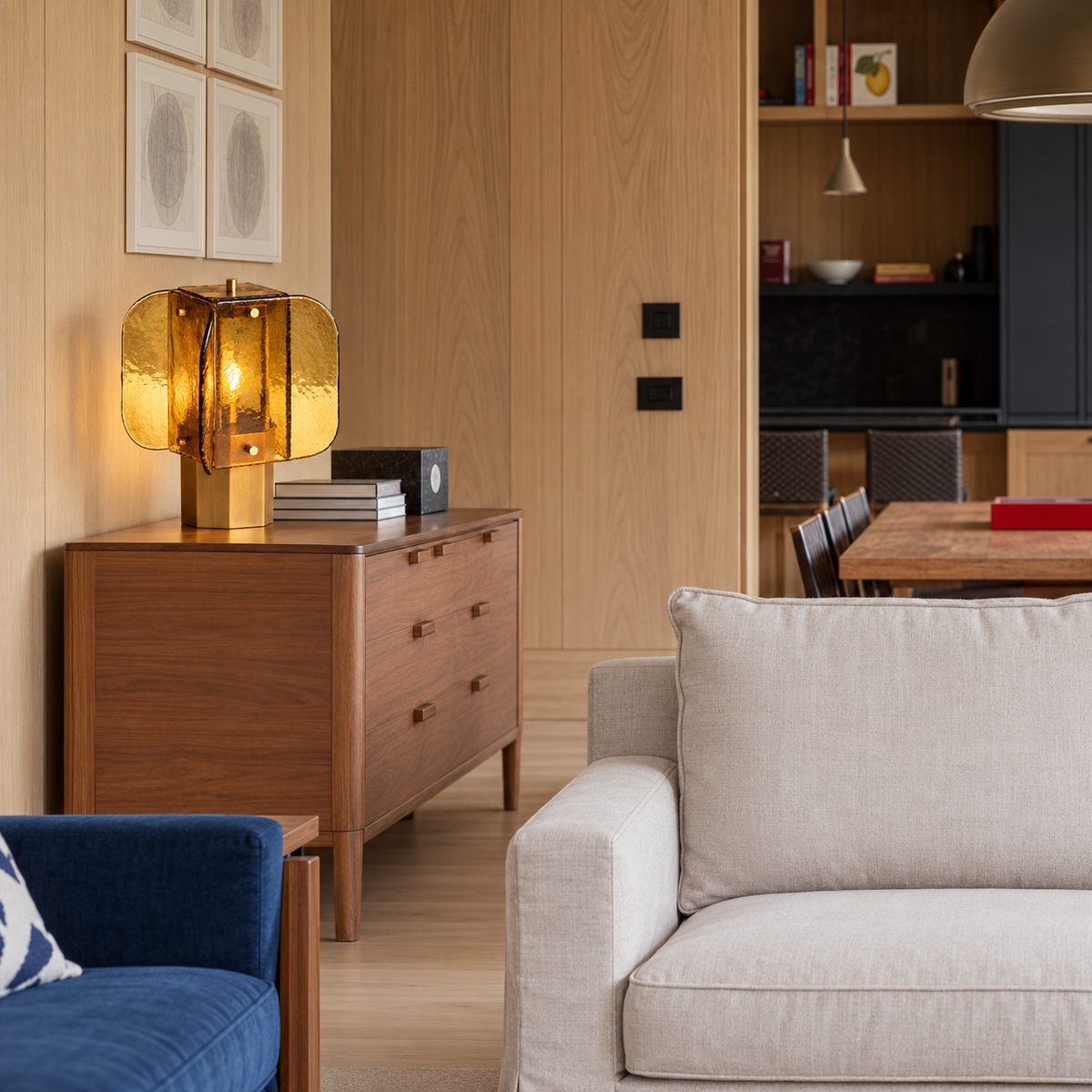 Amber glass table lamp on a walnut chest in a living room