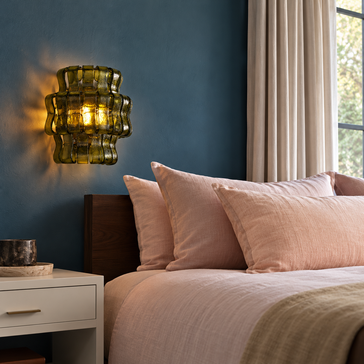 Bellatrix green glass wall sconce, installed beside a bed