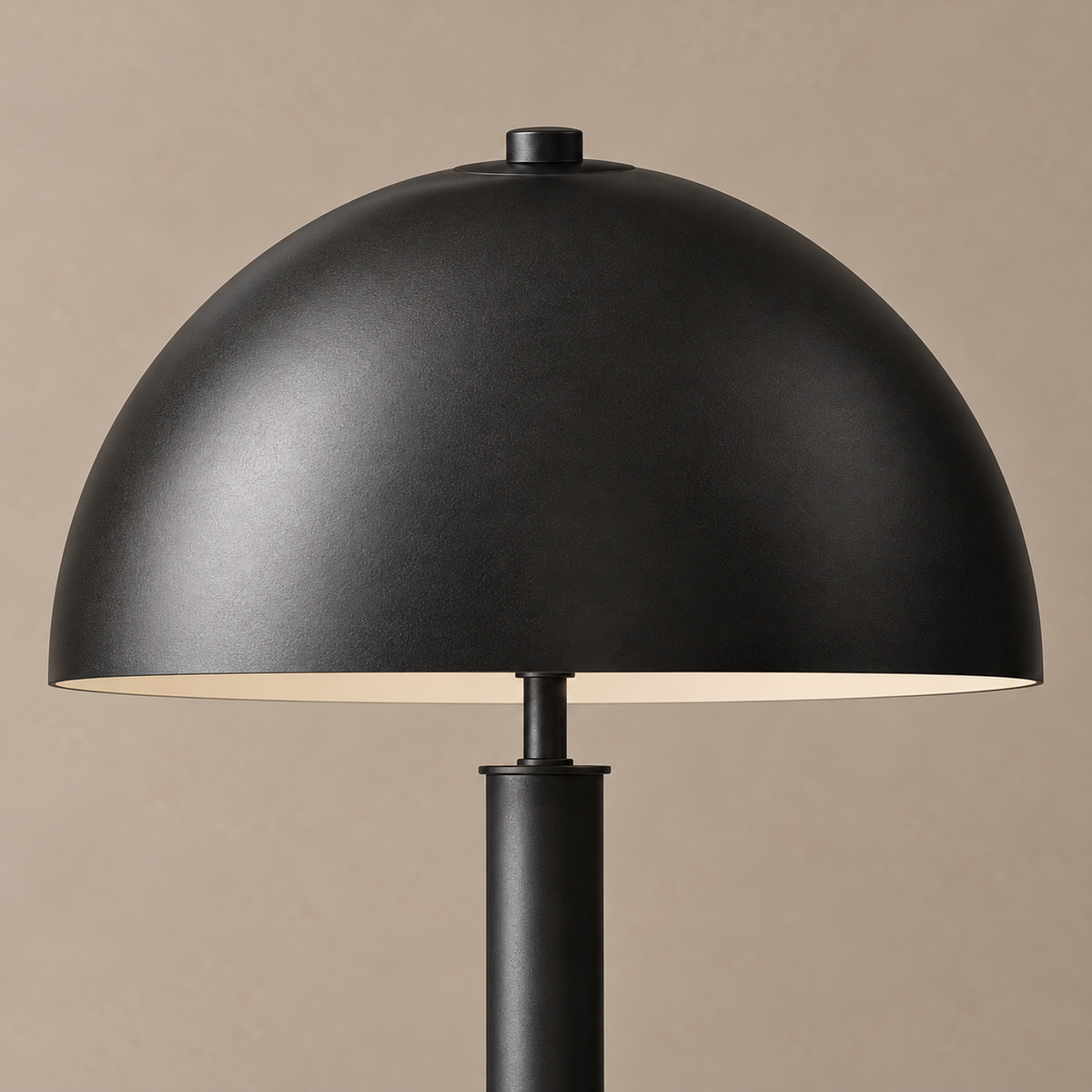 Detail of the black stainless steel dome, top cap and central stem.