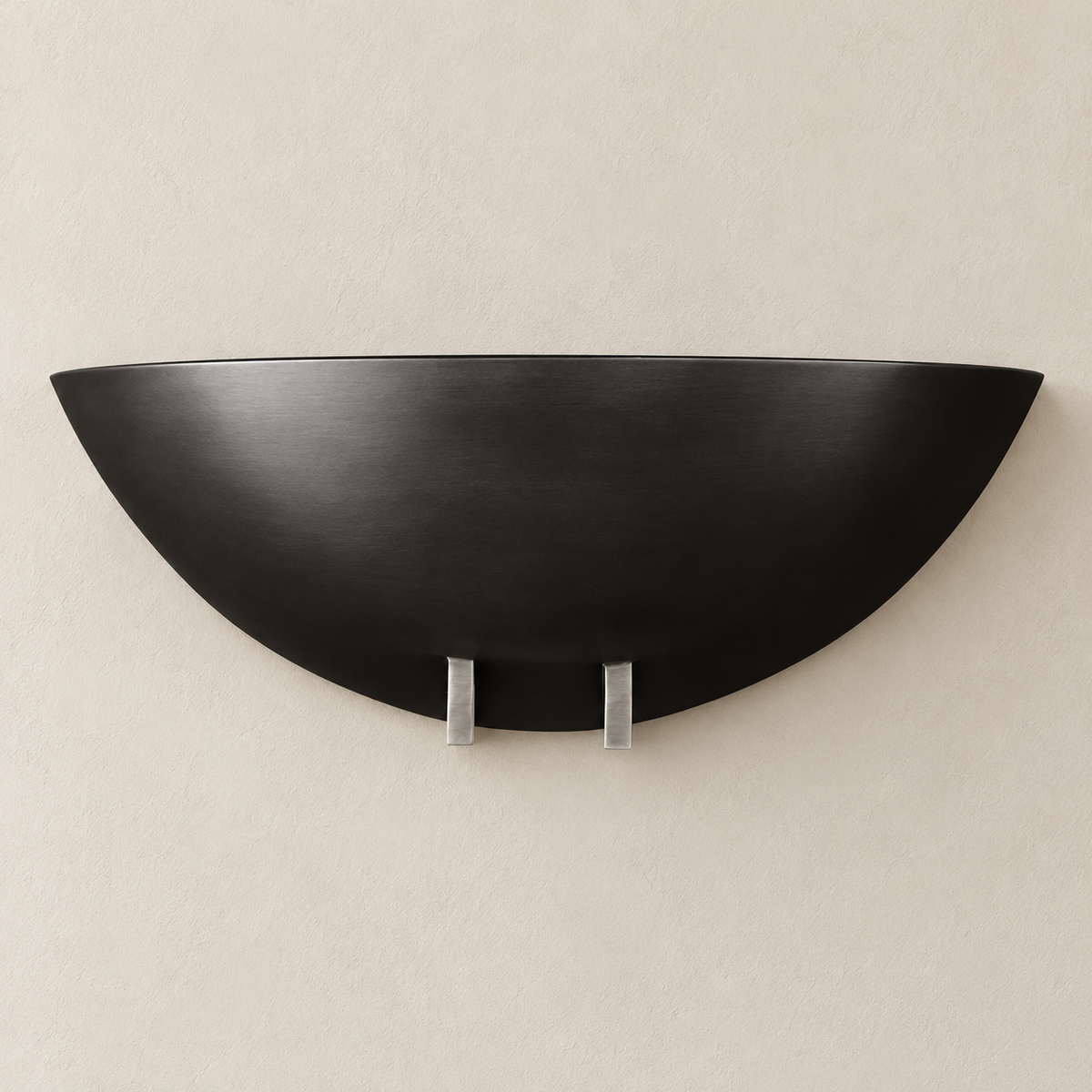 Black bowl wall sconce switched off on a beige wall.