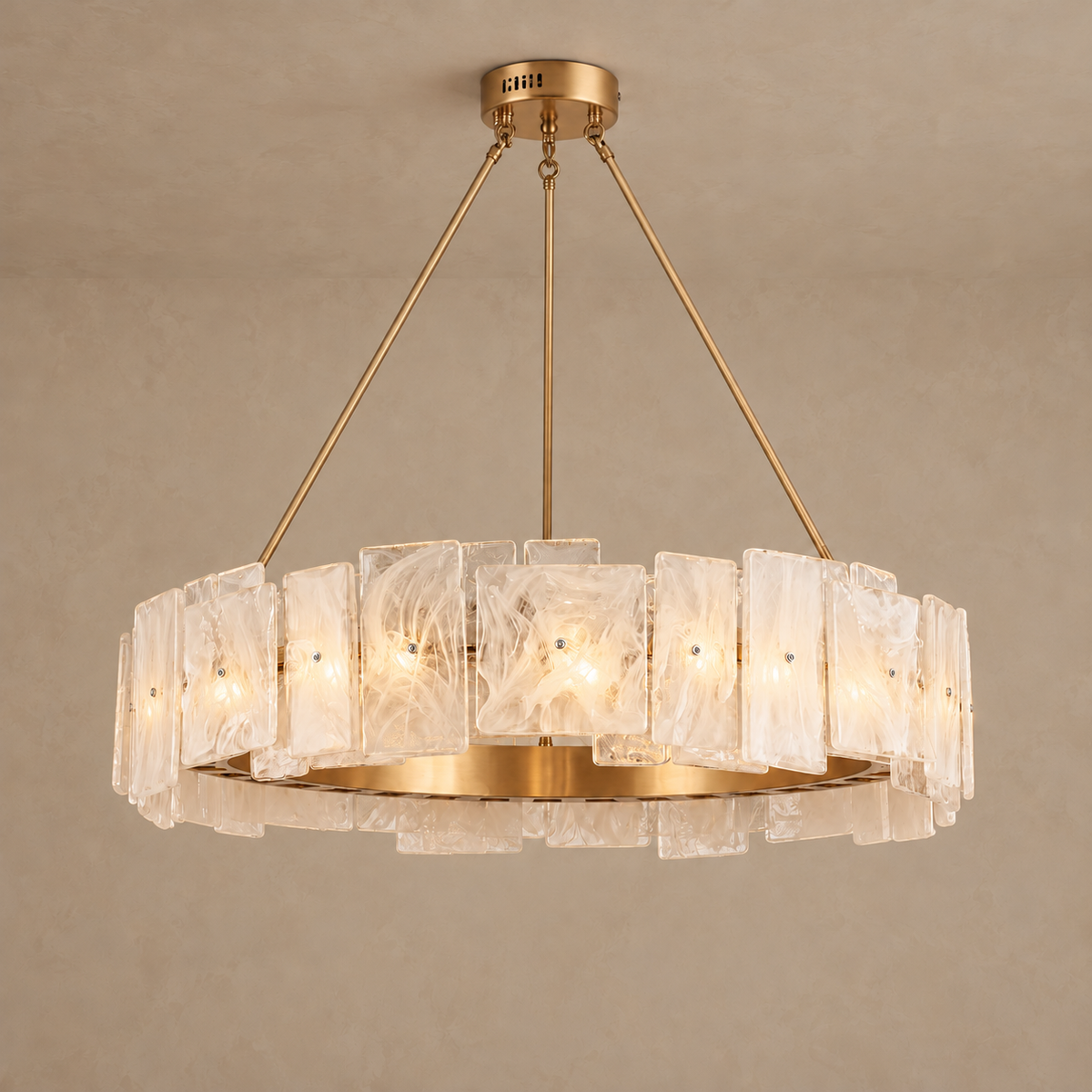 CX Carine ring chandelier illuminated behind white-streaked glass panels