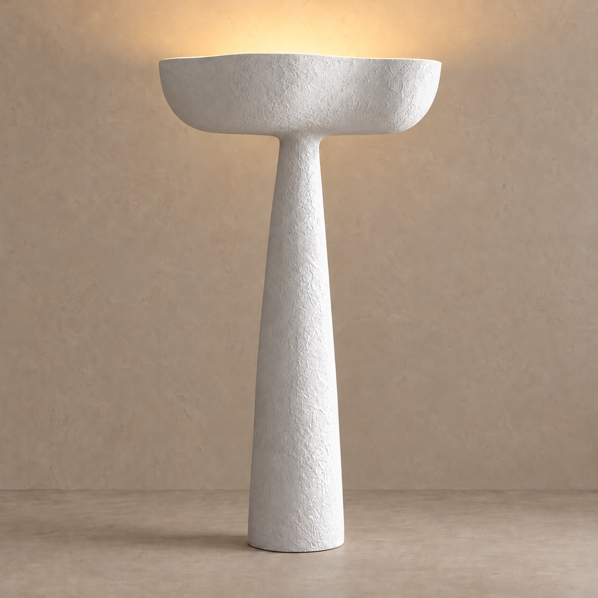 Cassia CLBBGT027 plaster floor lamp illuminated with light directed upward from its basin.