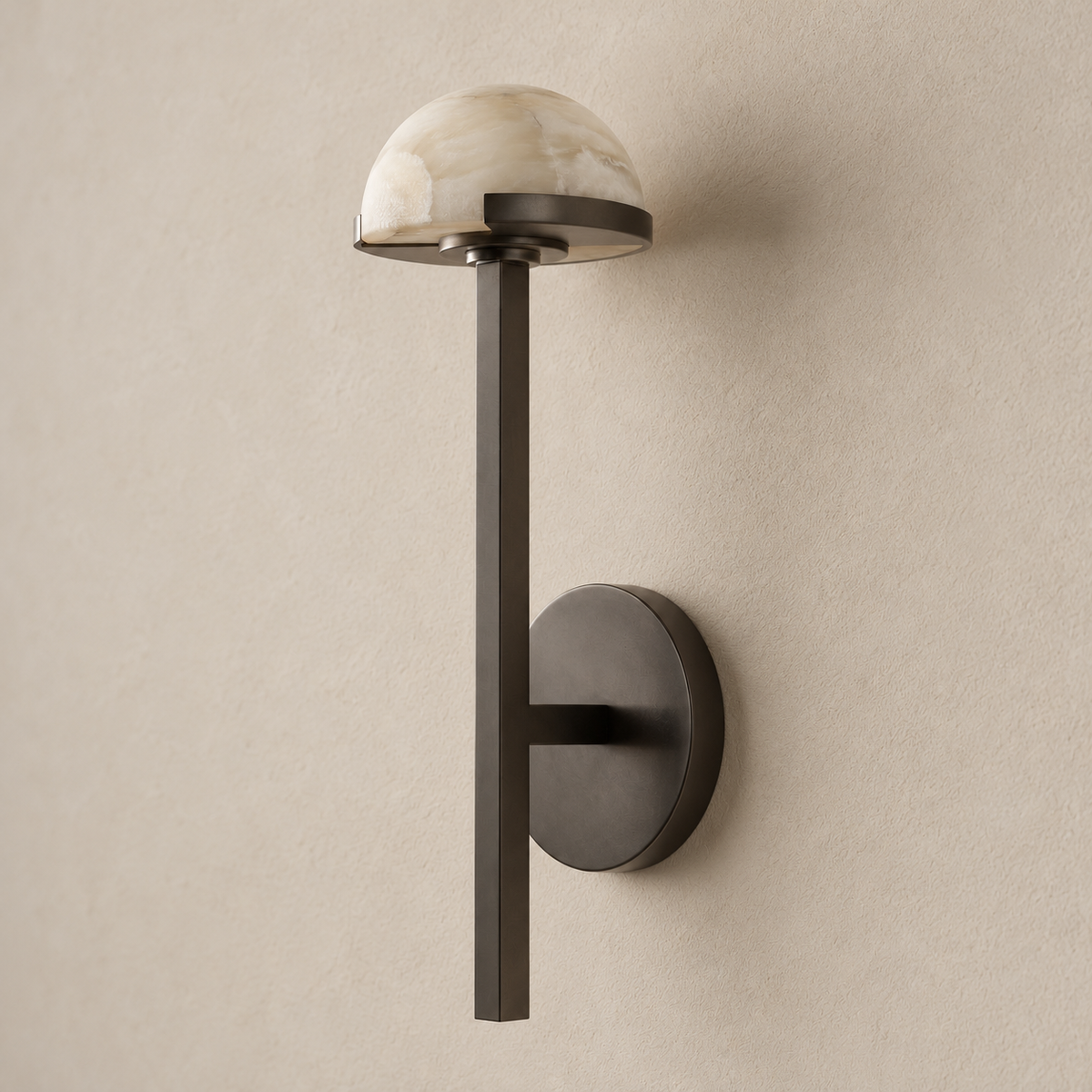 Alabaster half-dome wall sconce with black steel stem, switched off.
