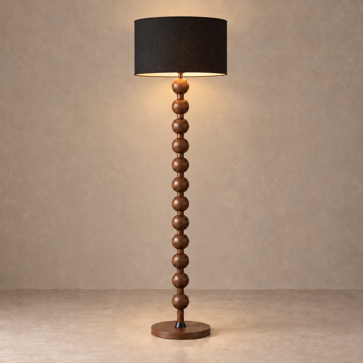 CL40XZ8 walnut-tone floor lamp illuminated beneath its black fabric drum shade.