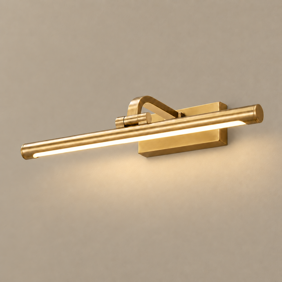 Brass linear LED picture light, illuminated on a stone-beige wall