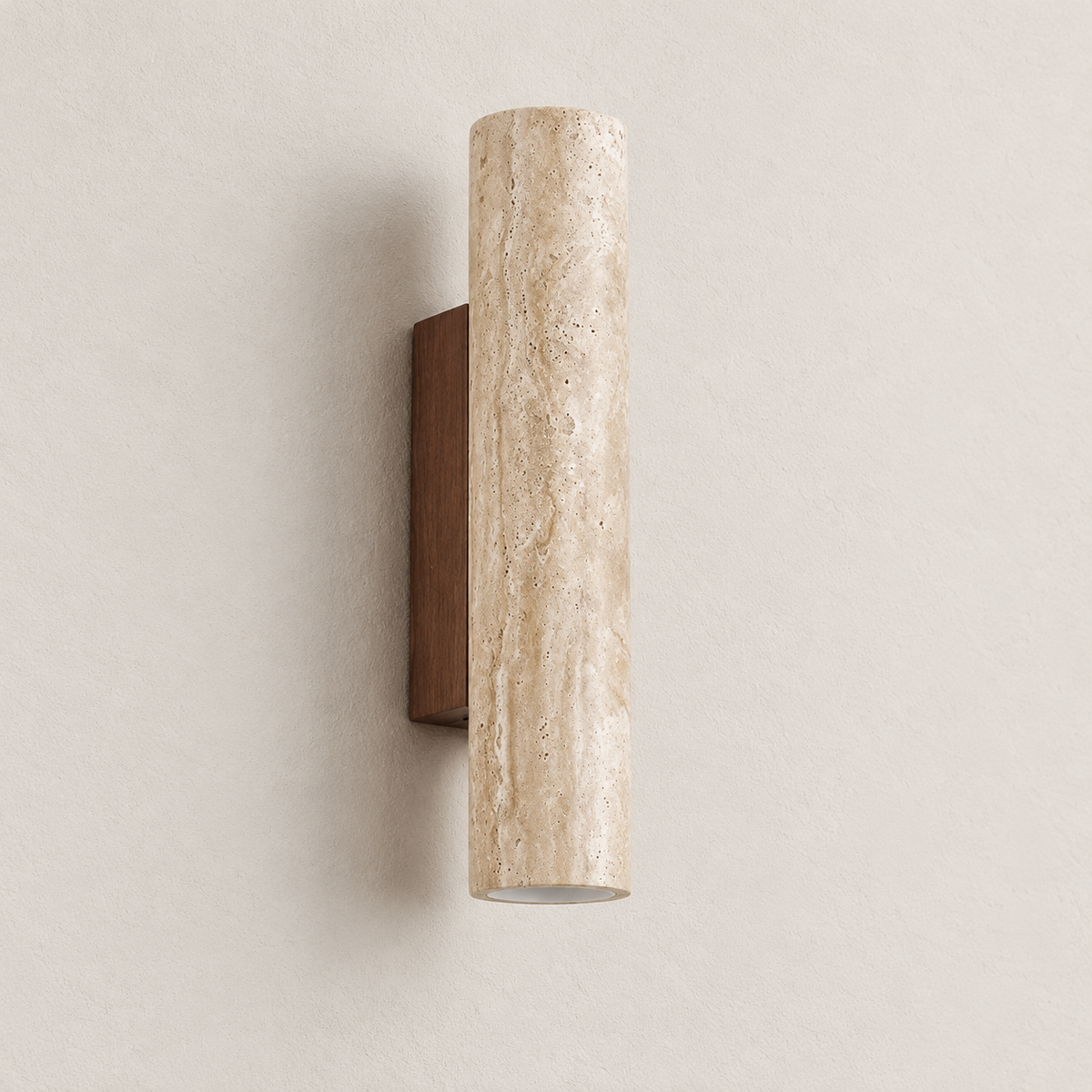 Angled view of the unlit travertine cylinder and its rectangular wooden wall backplate.