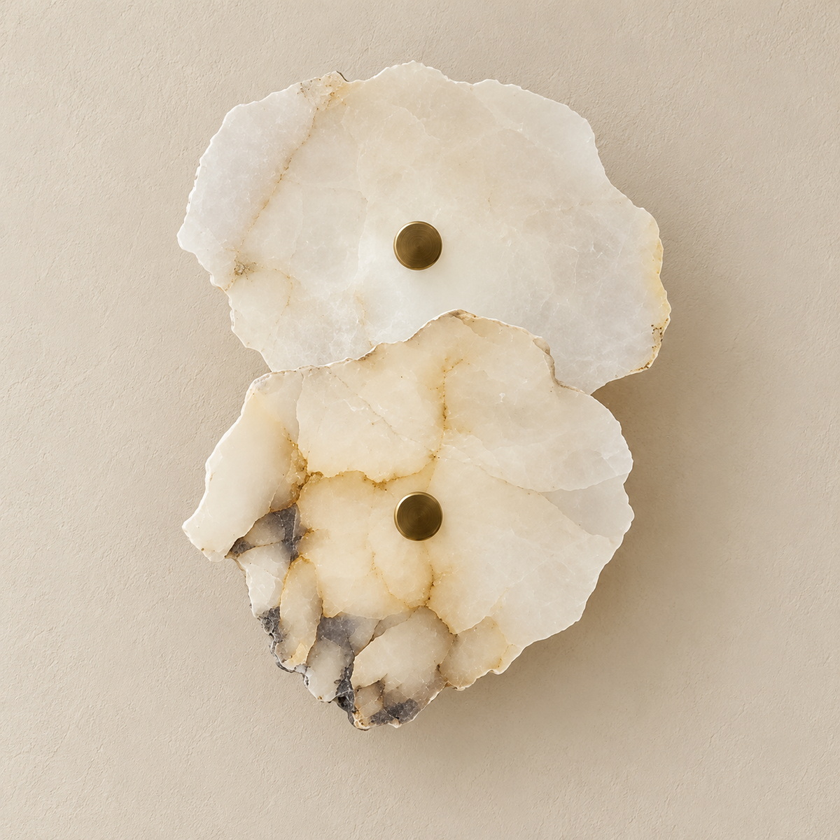 Unlit 2-stone marble wall sconce with irregular layered panels and brass retaining caps.