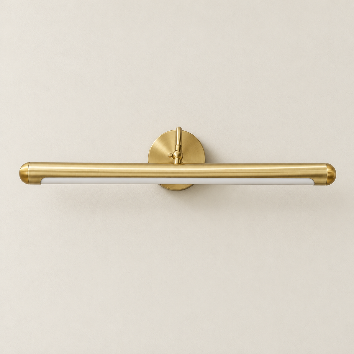 Brass picture light with round wall plate, switched off.