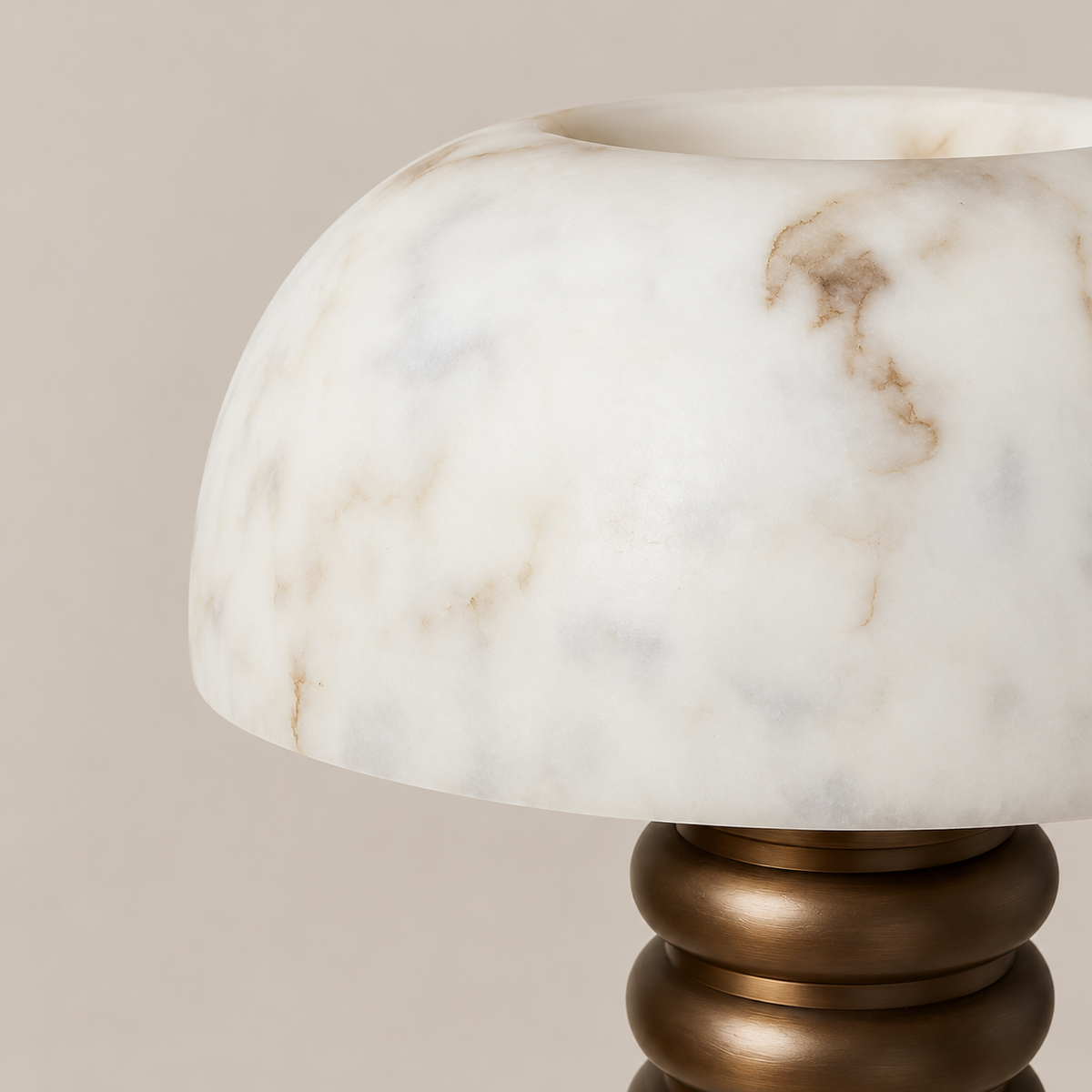 Close-up of the alabaster dome, natural mineral markings and bronze base.
