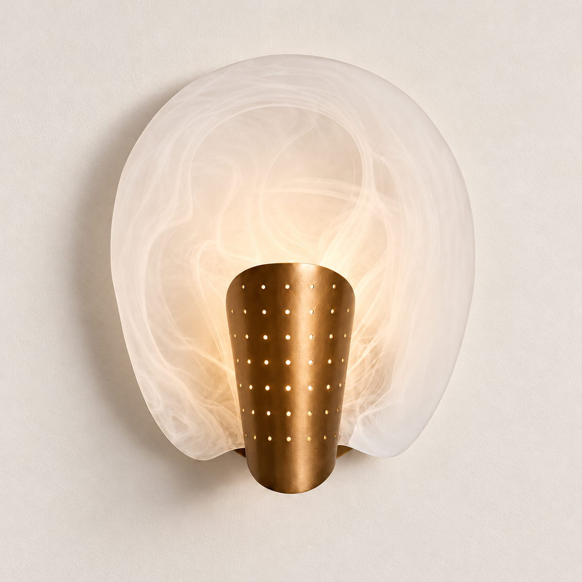 Halo glass and brass sconce illuminated in the same ivory setting.