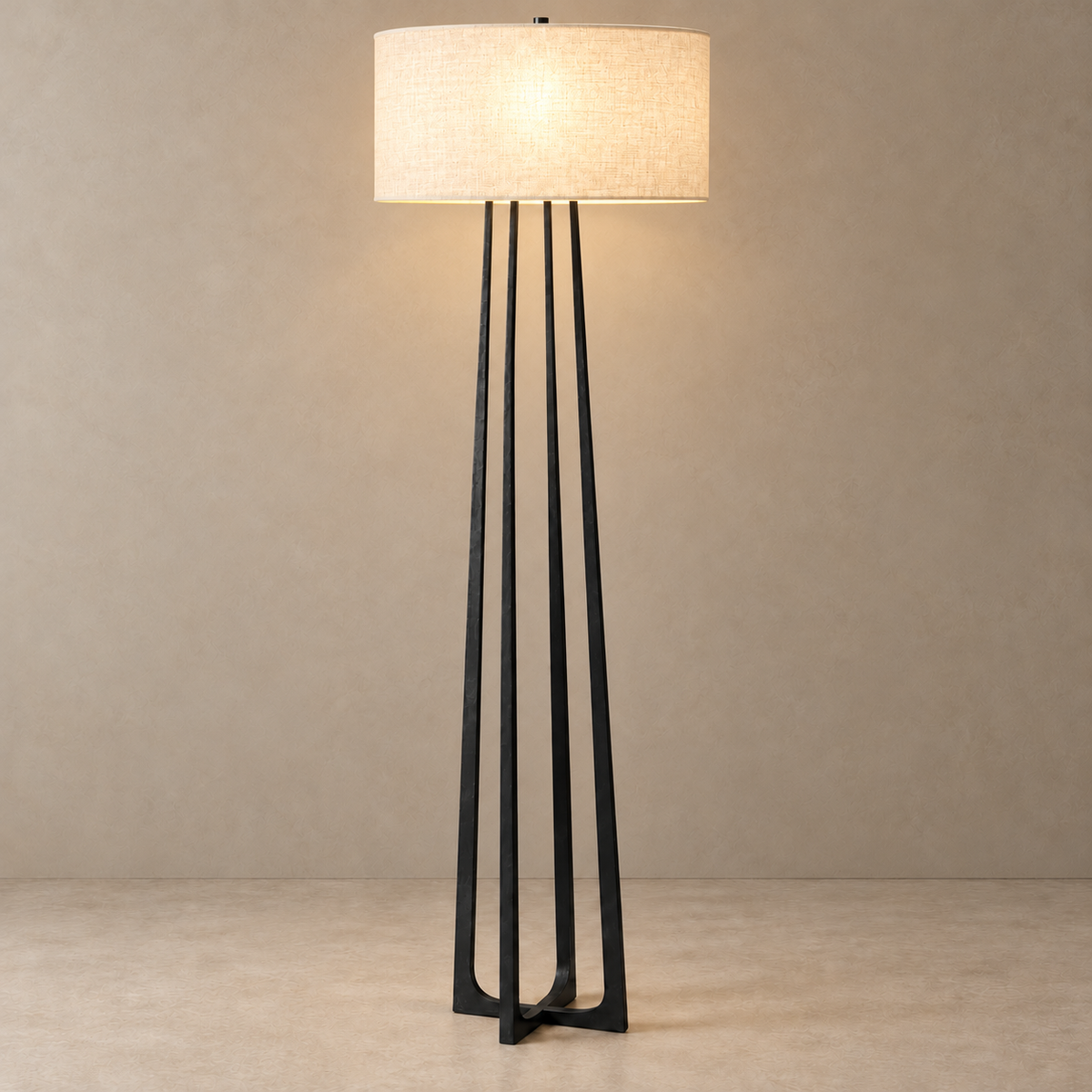 CLHJRH054B floor lamp with its linen drum shade illuminated above the black crossed frame.