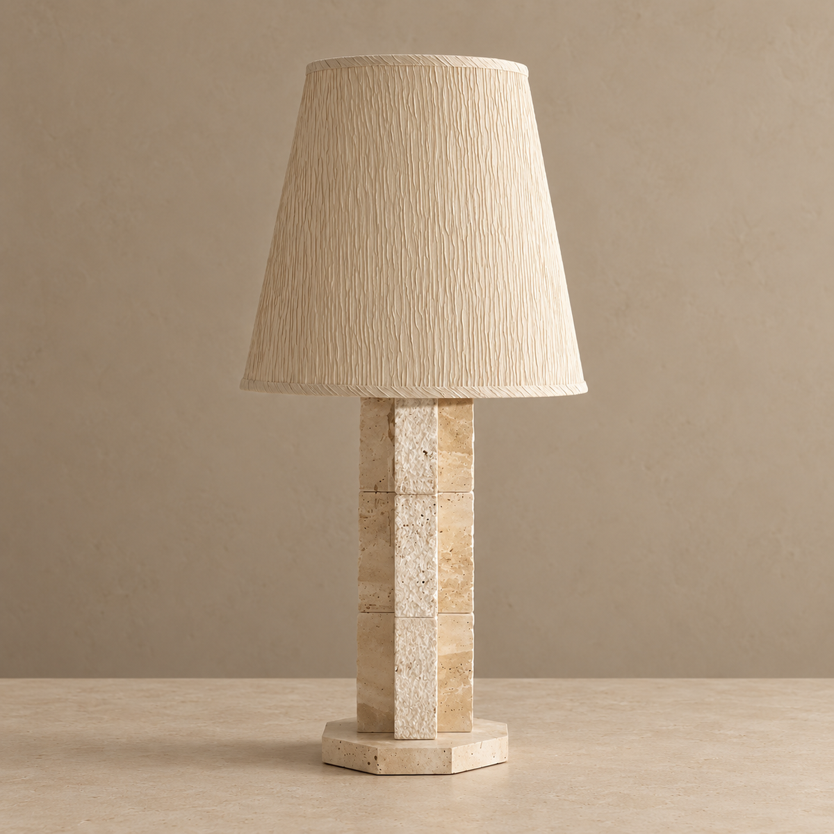 Unlit travertine block lamp with a textured cream shade.