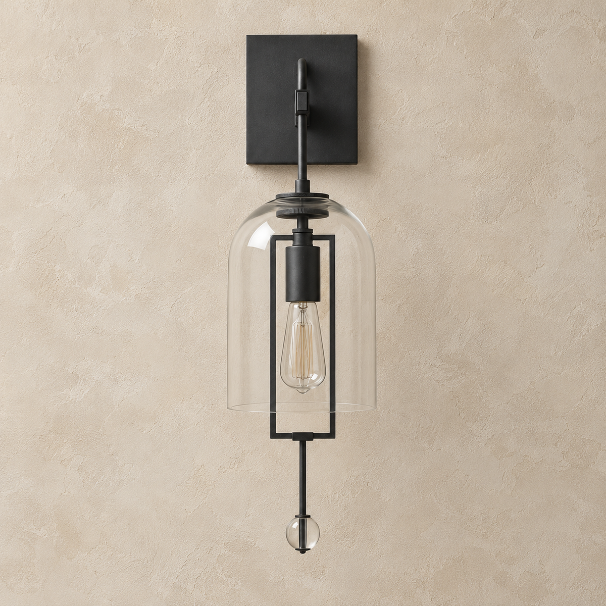 Black wall sconce with a clear glass bell and crystal finial, switched off on beige plaster.