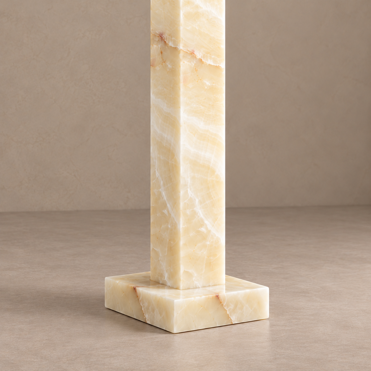 Detail of the honey onyx column and shallow square stone base.