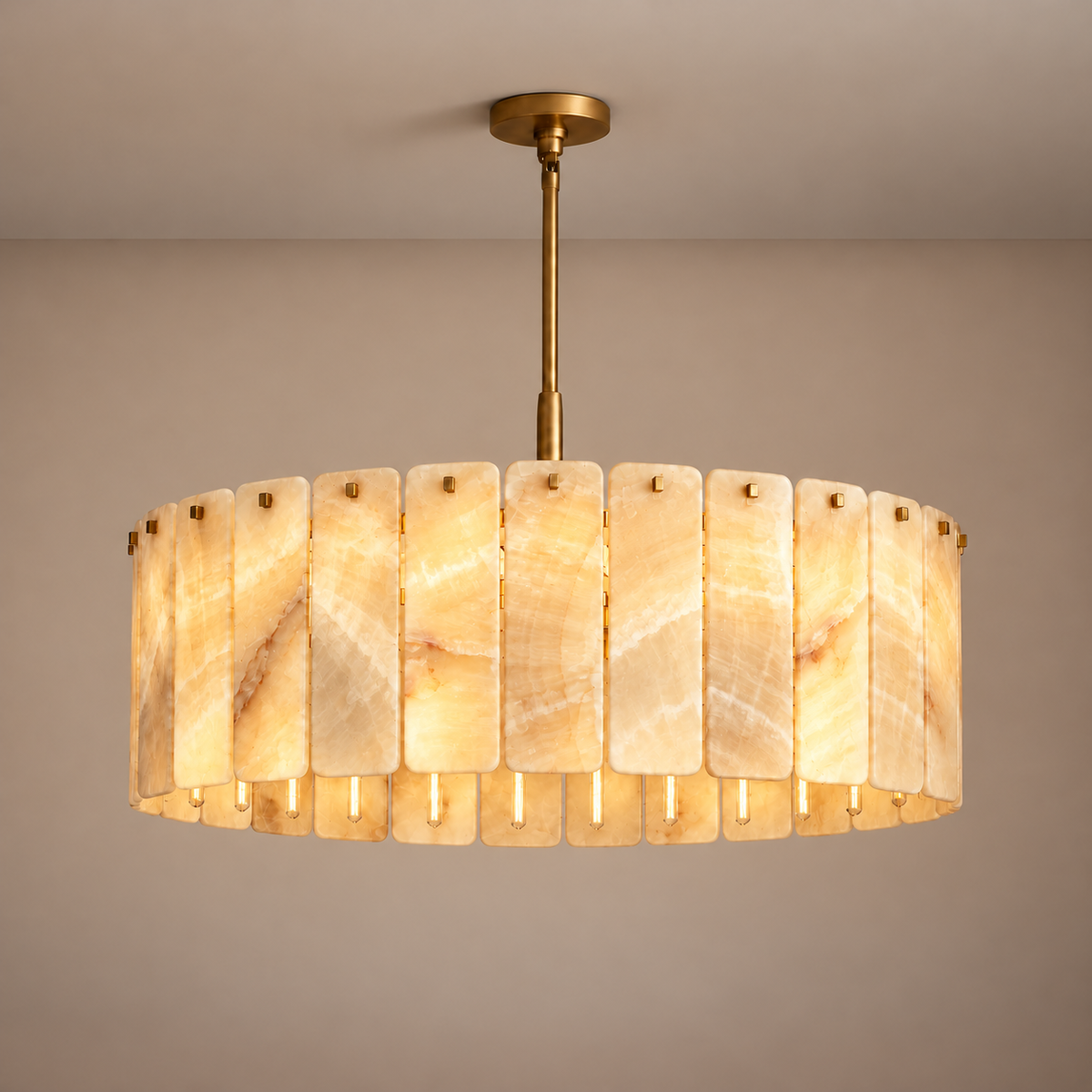 Matra Corona honey onyx chandelier illuminated, with natural mineral bands visible.