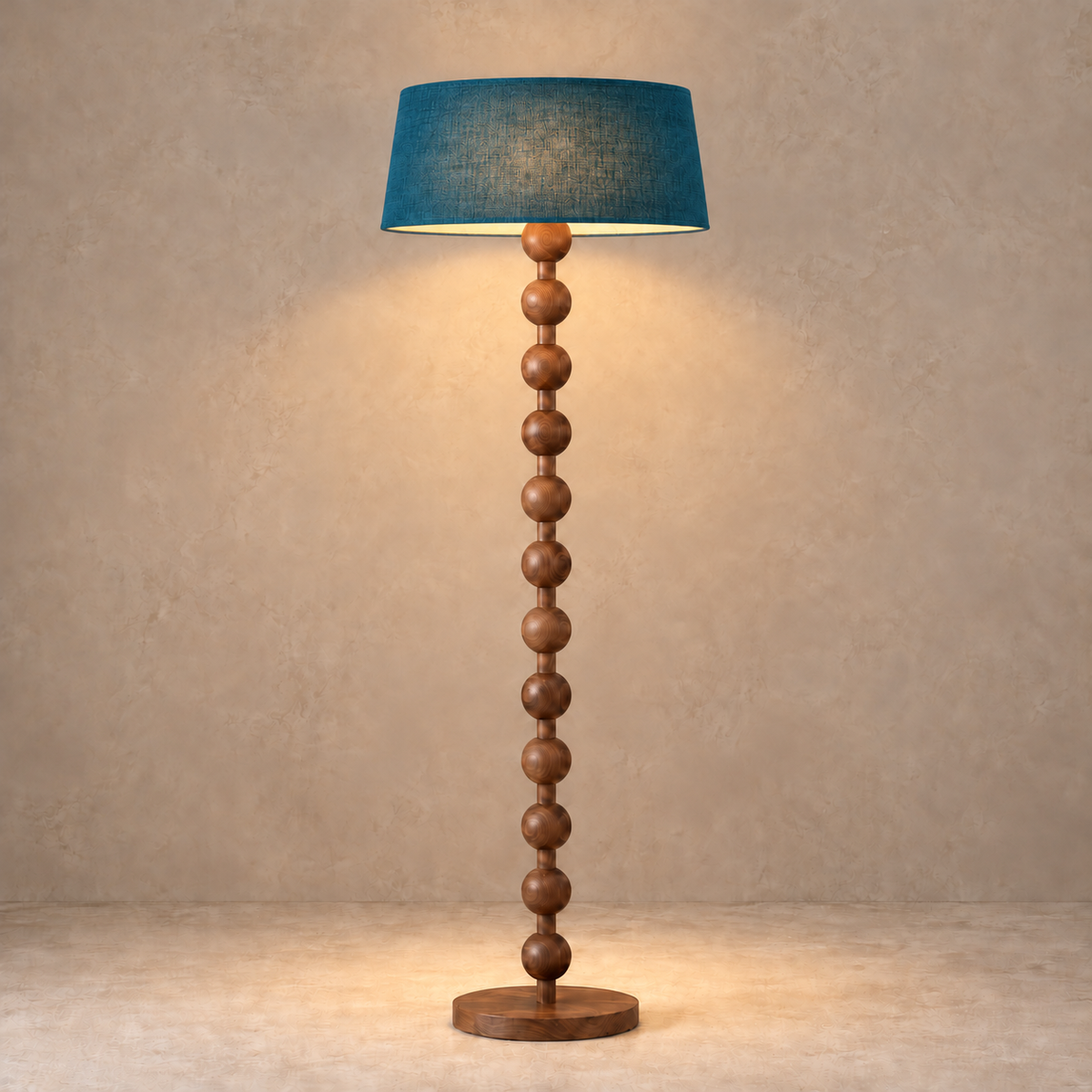 Sirmione Walnut Floor Lamp with petrol blue linen shade, illuminated in natural daylight.