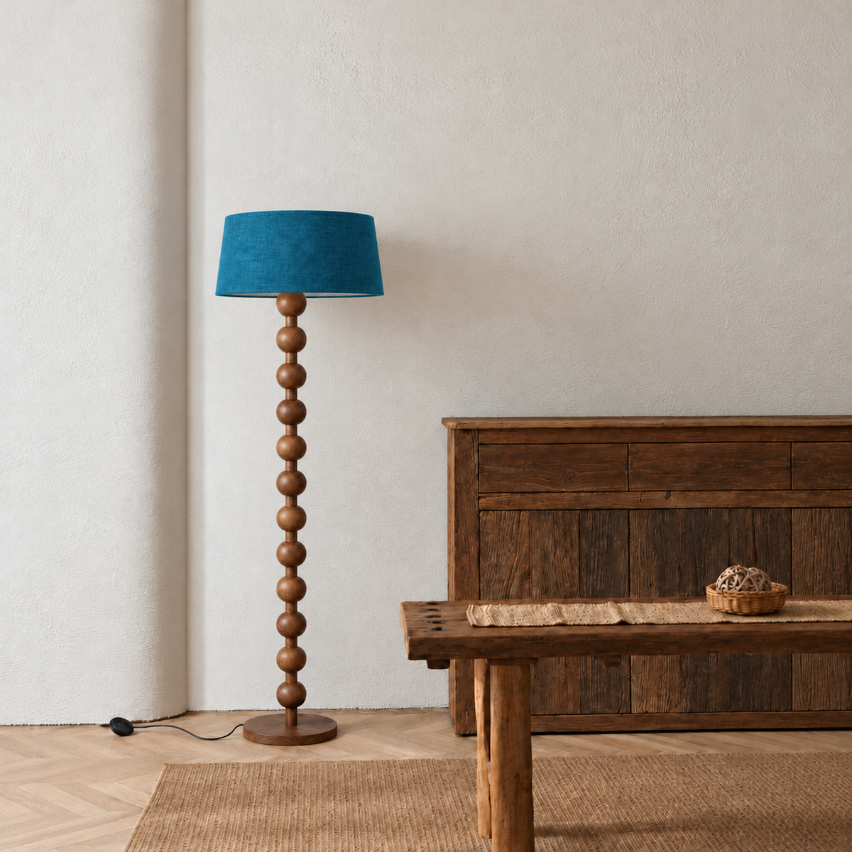 Sirmione Walnut Floor Lamp with petrol blue linen shade in a furnished room.